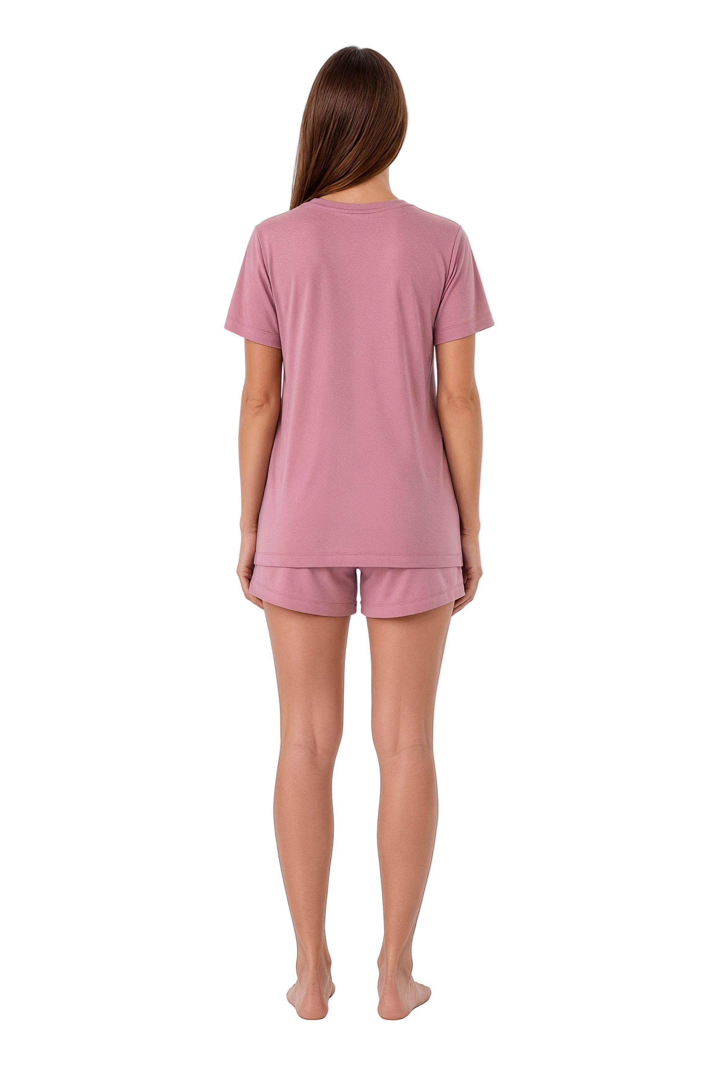 A woman viewed from the back wearing a dusty pink short-sleeve pajama top and matching shorts against a plain white background.