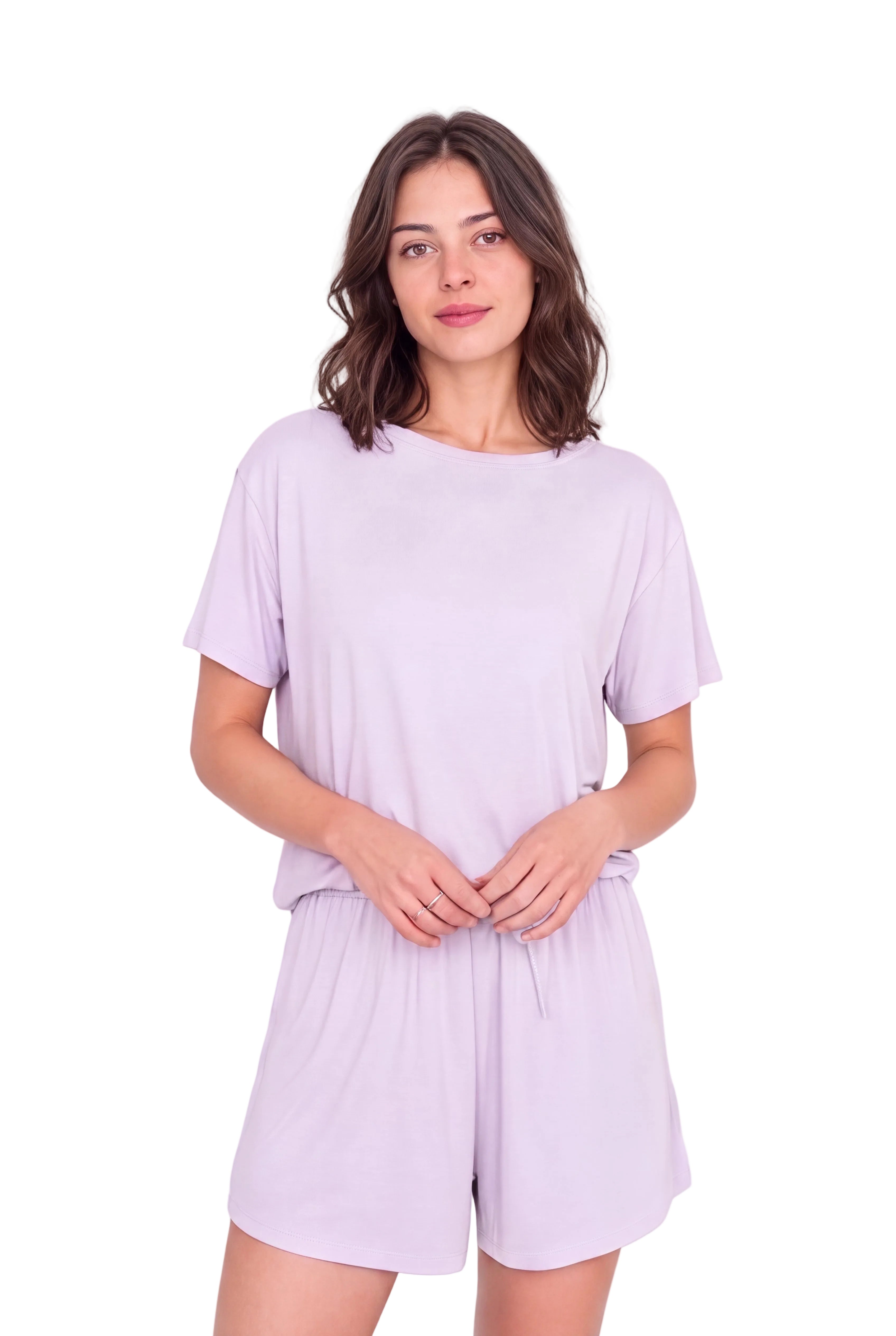 A woman modeling a light purple/lavender short-sleeve t-shirt and matching drawstring shorts set against a plain white studio background.