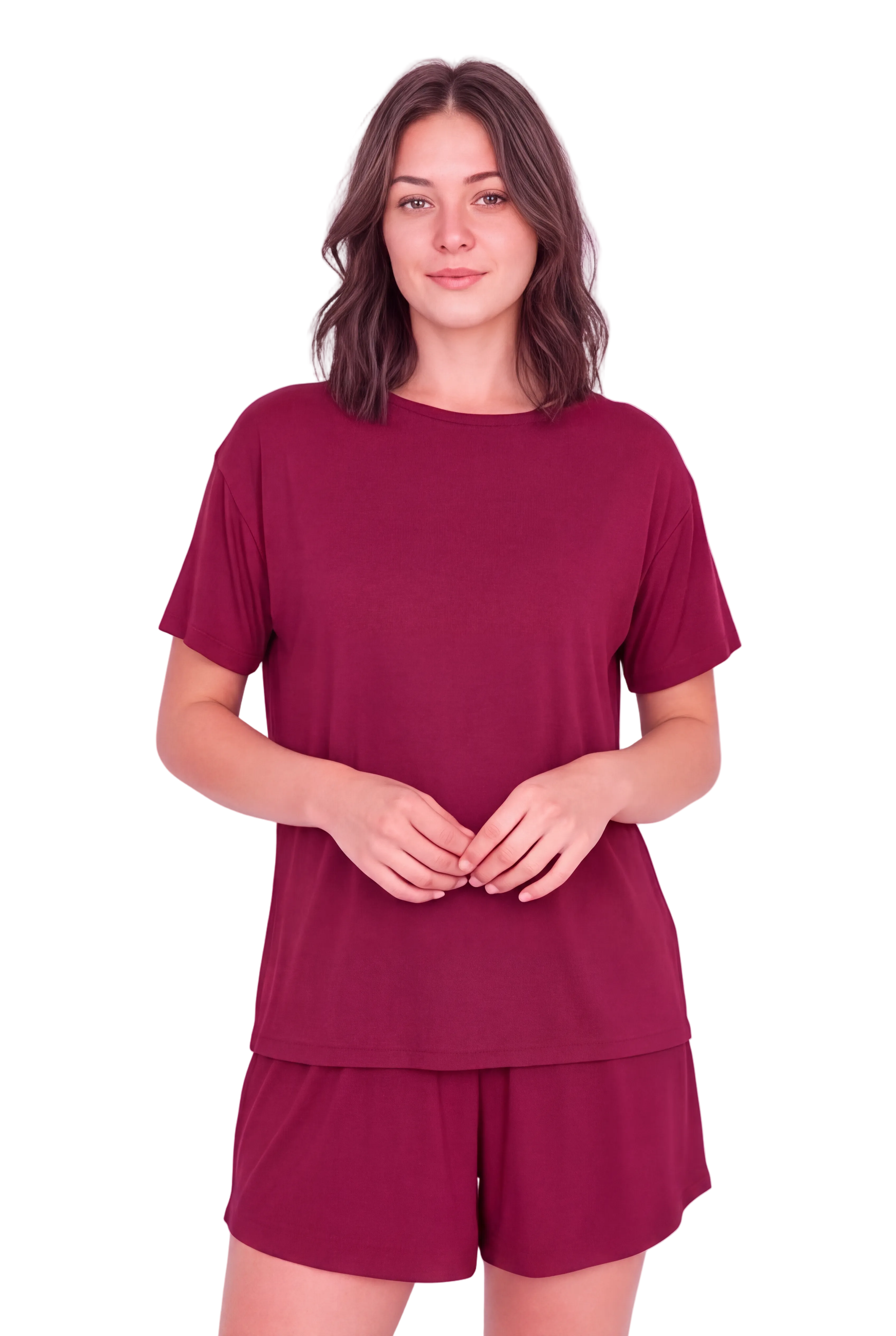 A woman modeling a matching burgundy short-sleeve t-shirt and shorts set against a solid pale pink background.