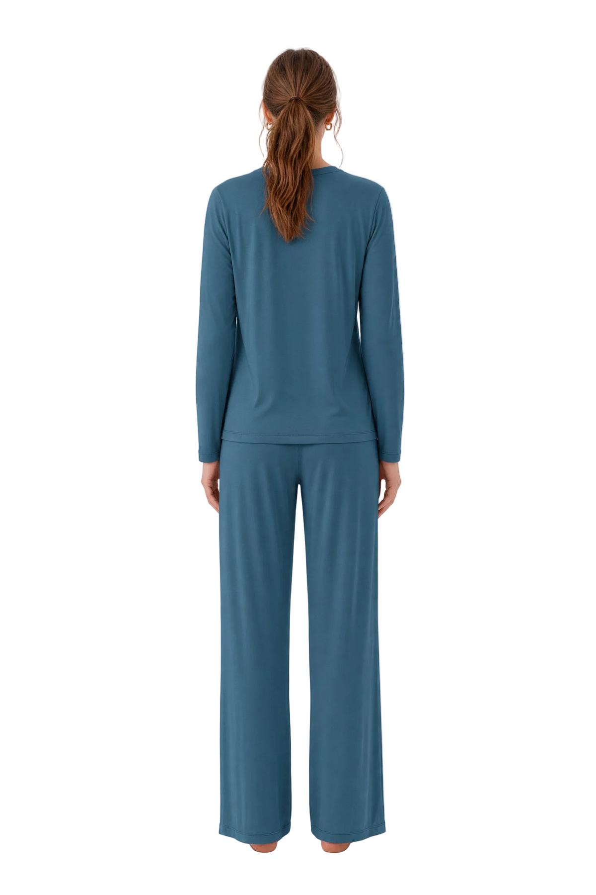 A woman viewed from the back wearing a matching long-sleeve top and wide-leg pants set in a muted teal-blue color, standing against a plain white studio background.