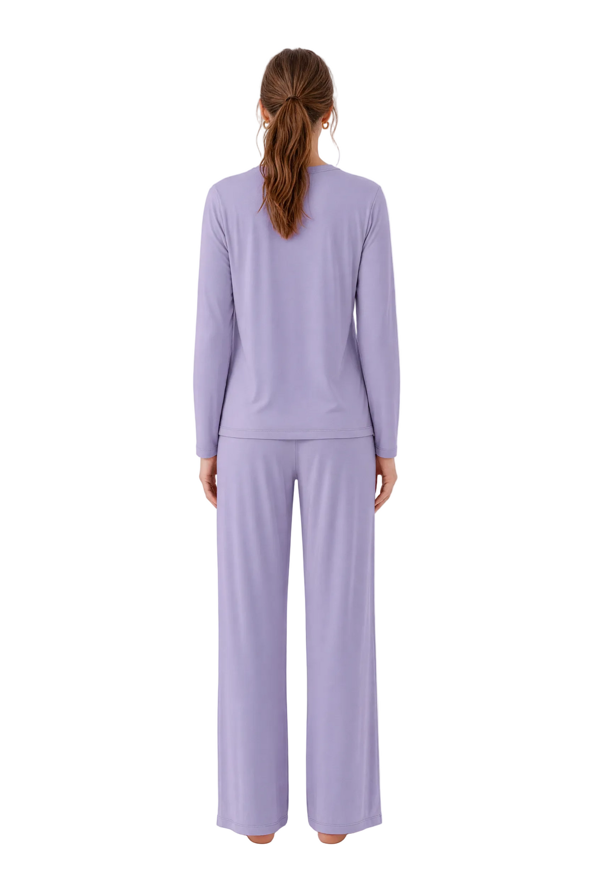 A woman viewed from the back wearing a matching lavender long-sleeve top and wide-leg pants set, standing against a plain white studio background.
