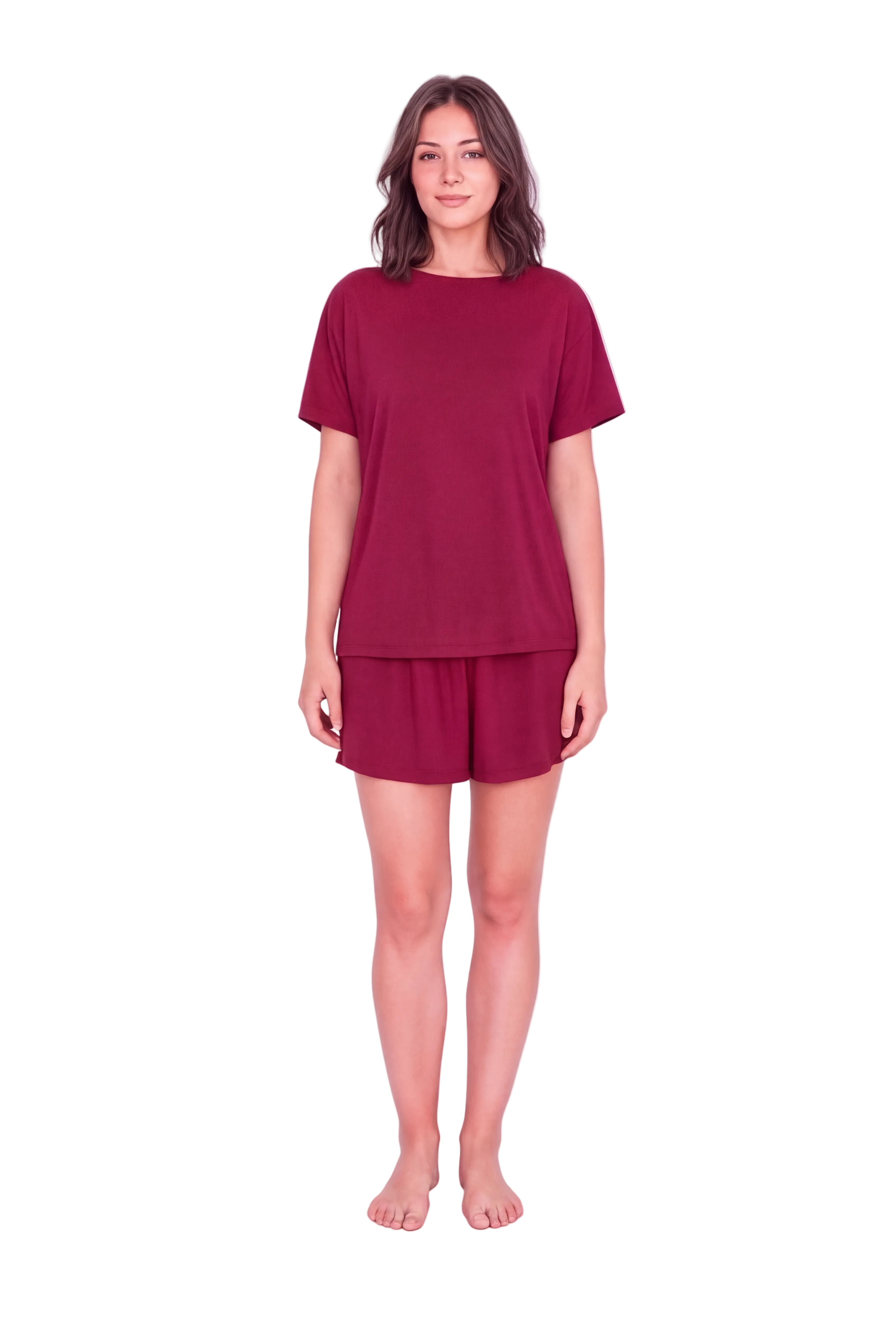 A woman modeling a matching two-piece lounge set consisting of a short-sleeve crewneck t-shirt and matching shorts in a deep burgundy color, shot against a seamless white studio background.